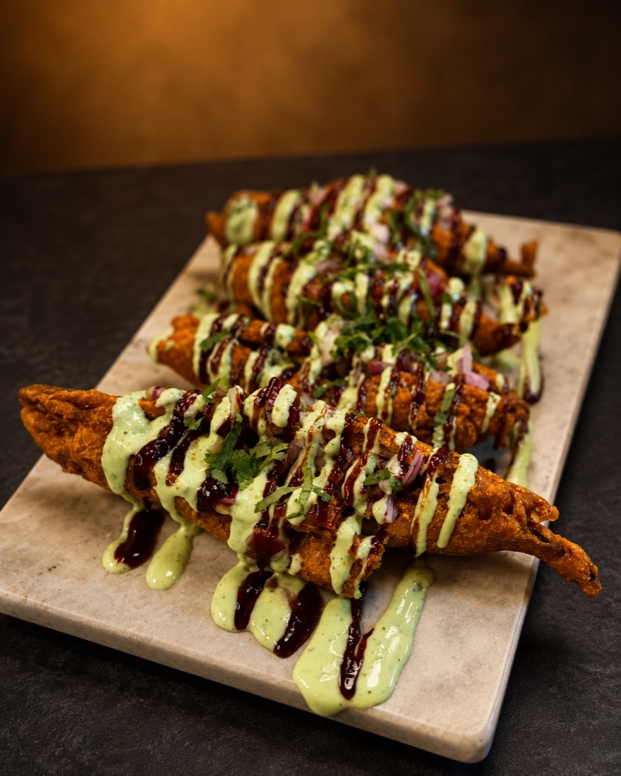 Masala mirchi ka pakora, stuffed green chillies in chickpea batter