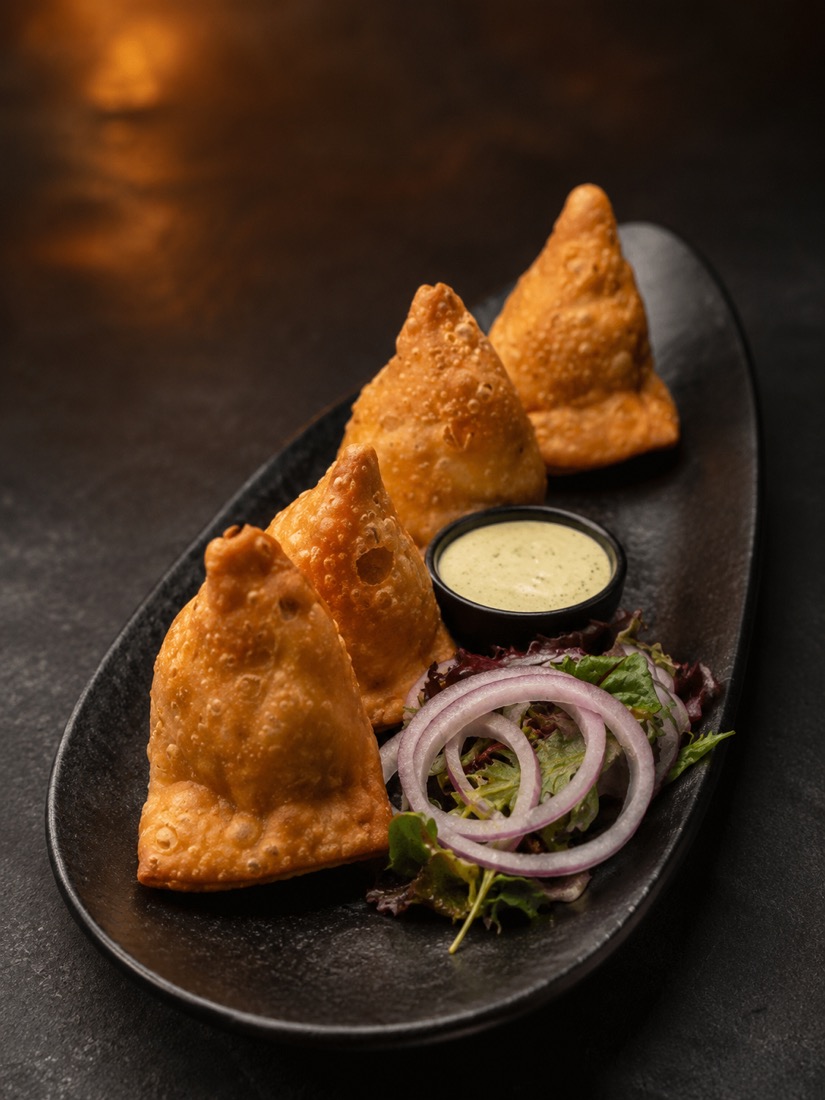 Veg samosas with mint sauce